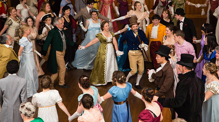 People dancing in historical clothing